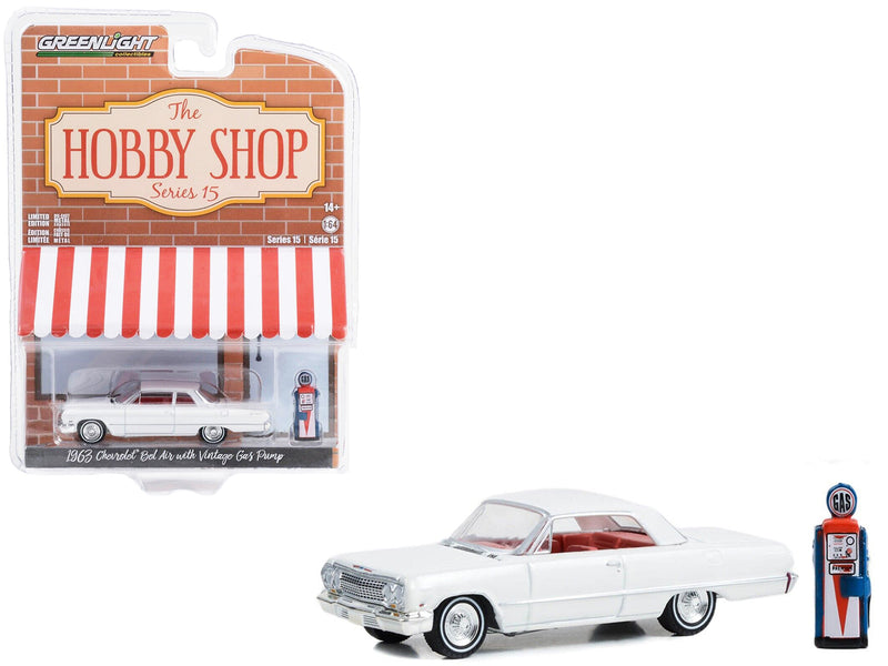 1963 Chevrolet Bel Air White with Orange Interior and Vintage Gas Pump The Hobby Shop Series 15 1/64 Diecast Model Car by Greenlight