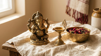 Handcrafted brass decor items on cream linen surface